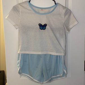 white crop top and matching light blue shorts set